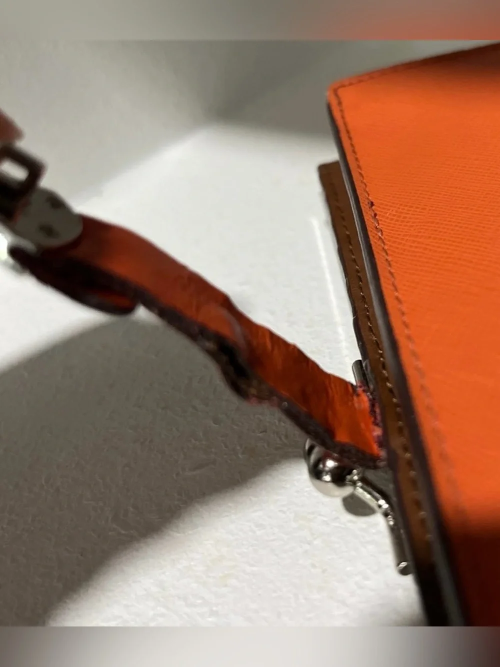 Tumi Orange and brown leather wallet